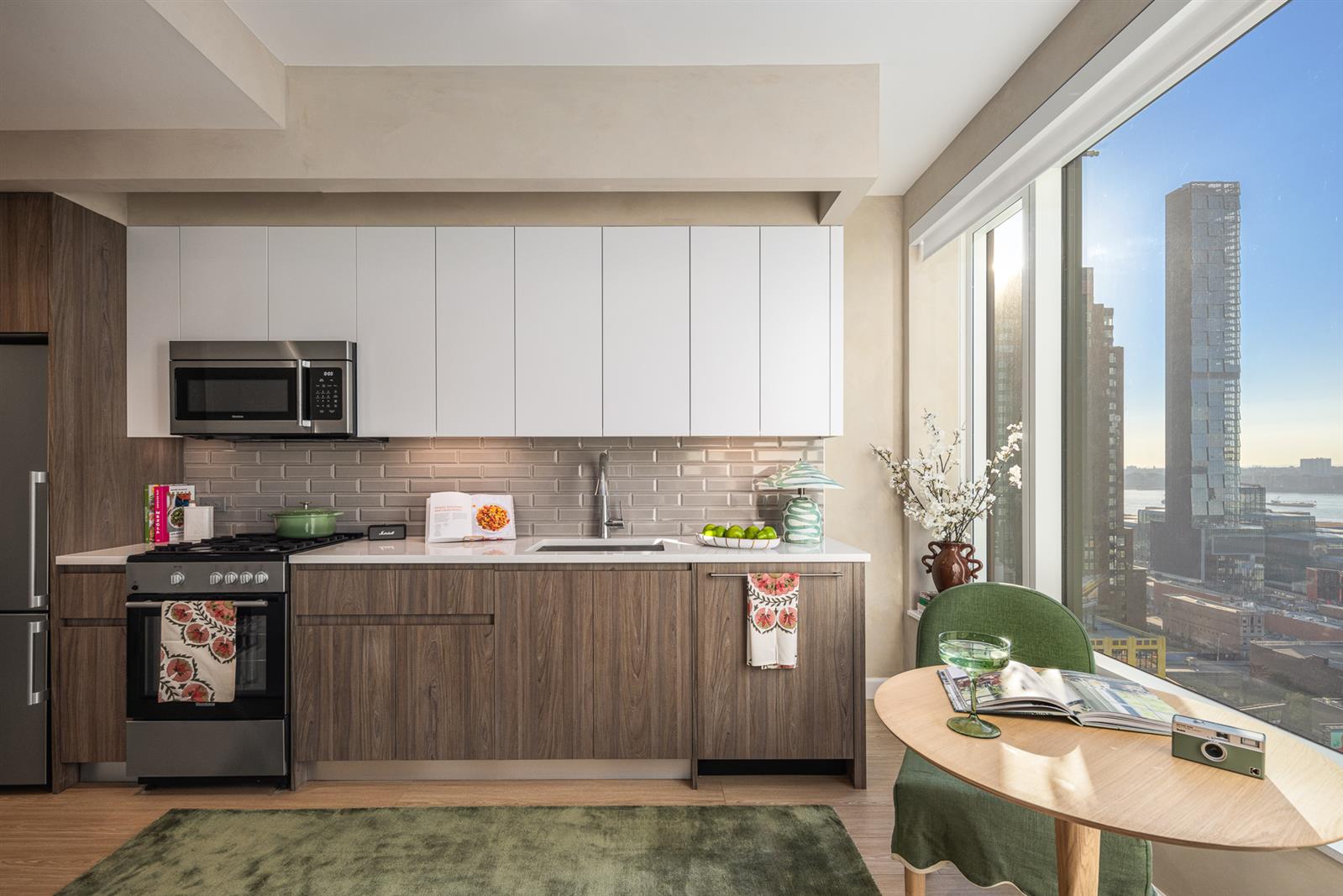 a kitchen with a sink cabinets and window