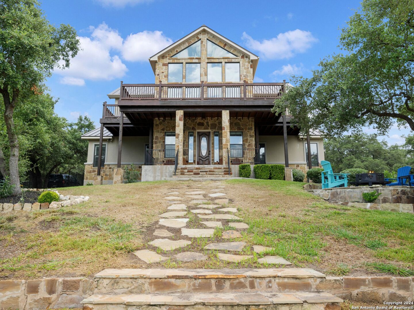 a front view of a house with garden