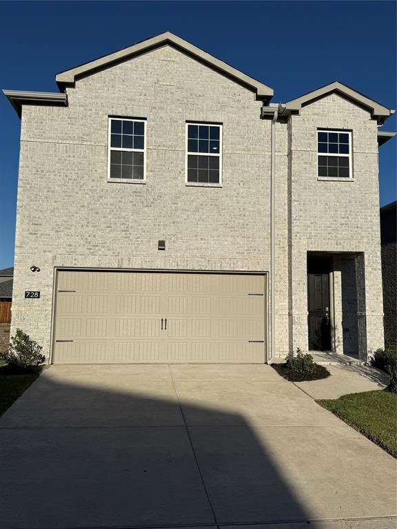 a front view of a house with yard