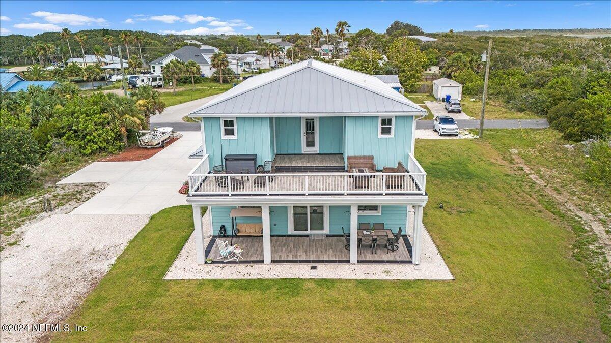 a aerial view of a house with a big yard