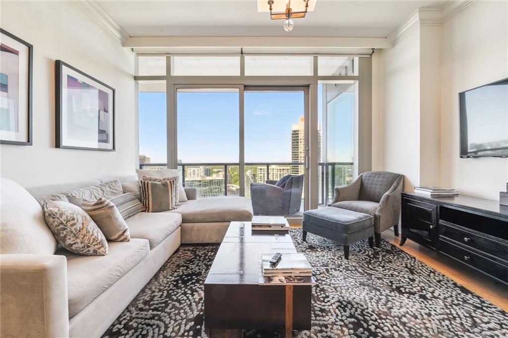 a living room with furniture and a rug