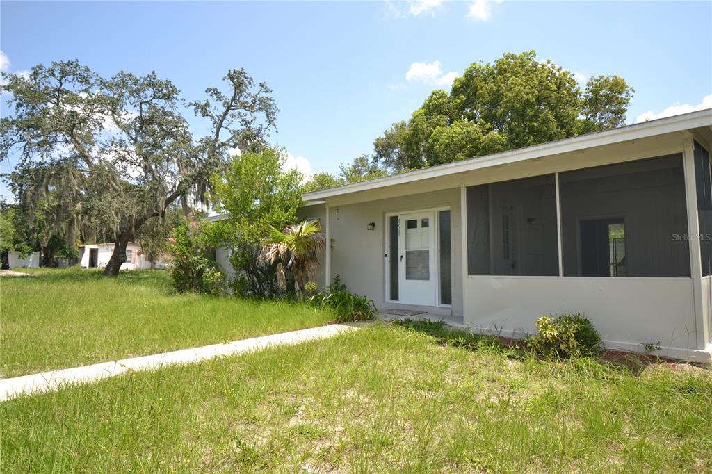 a view of house with yard