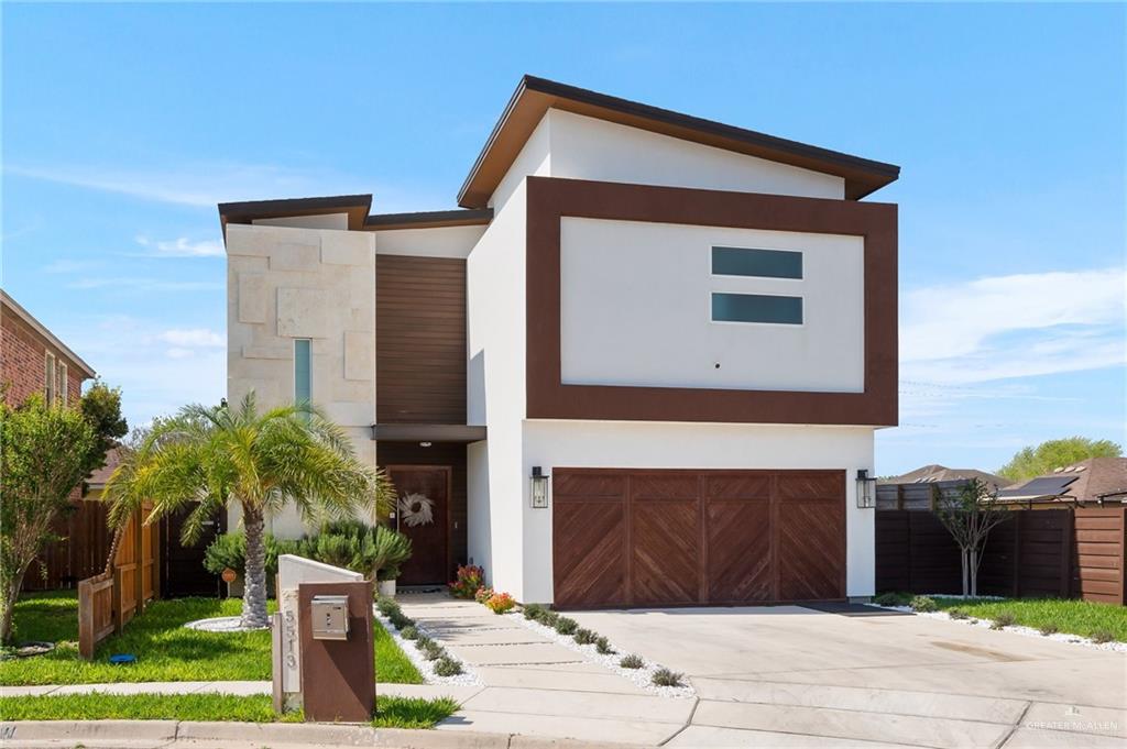 a house with palm tree in front of it