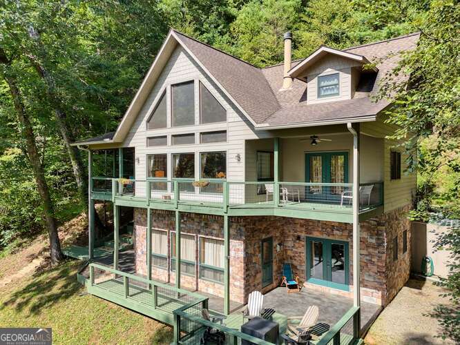 a view of a house with a yard and balcony