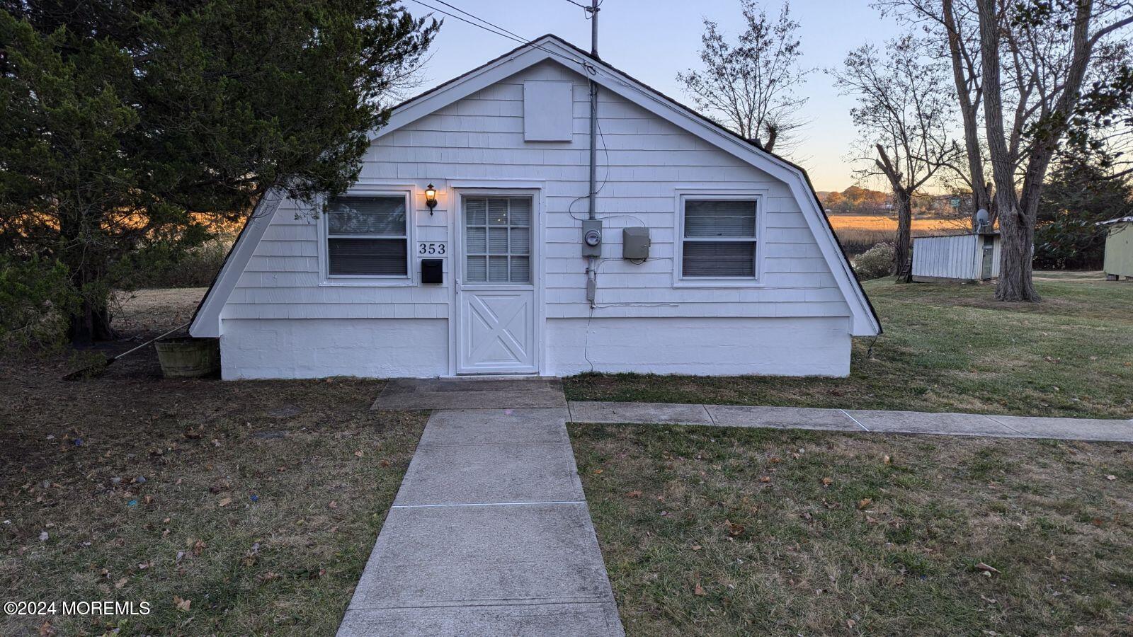 front view of a house with a yard