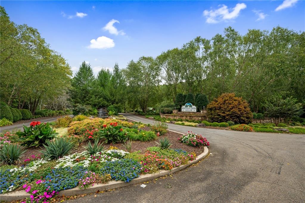 a view of a garden with sitting area