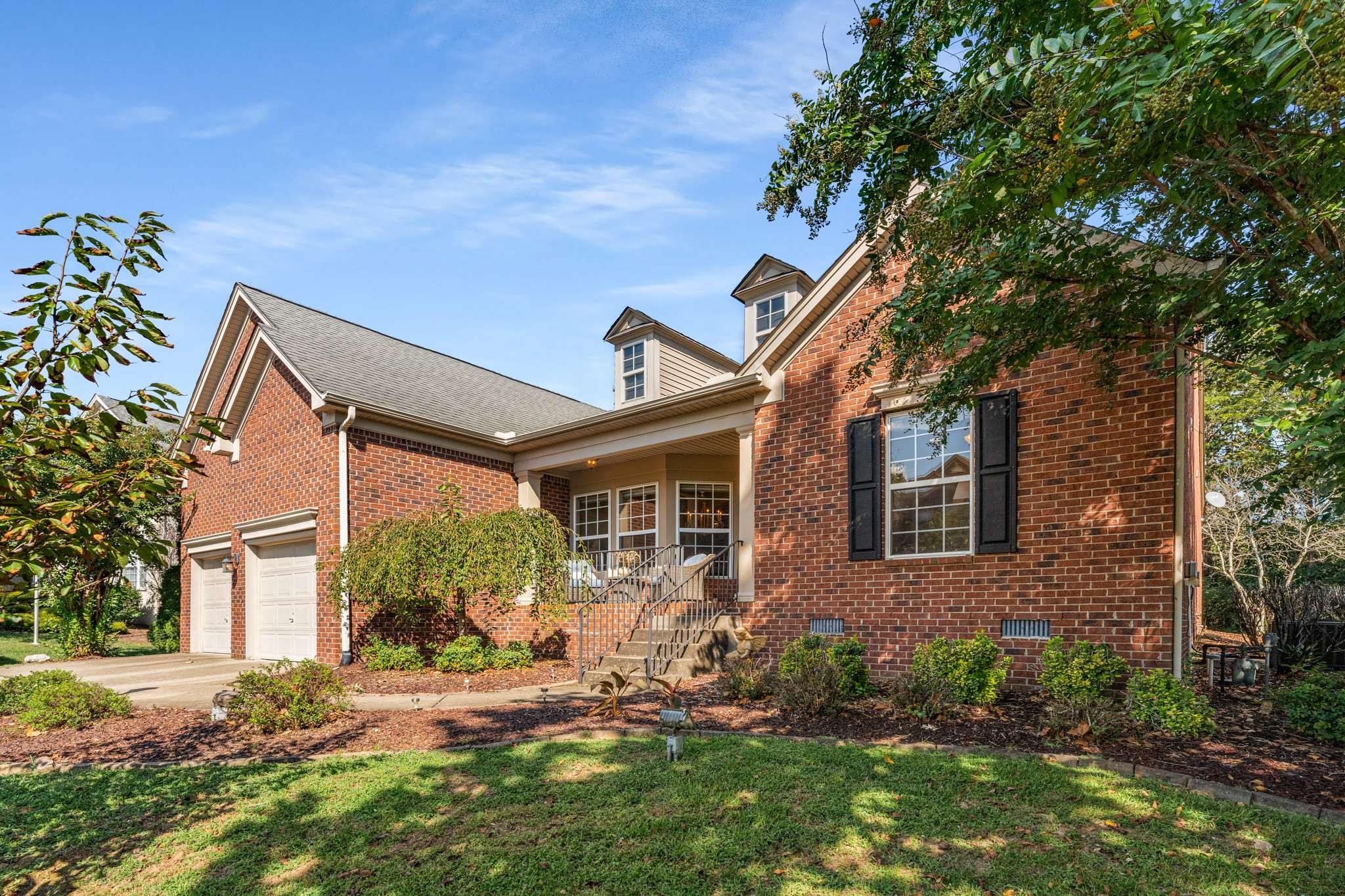 front view of a house with a yard