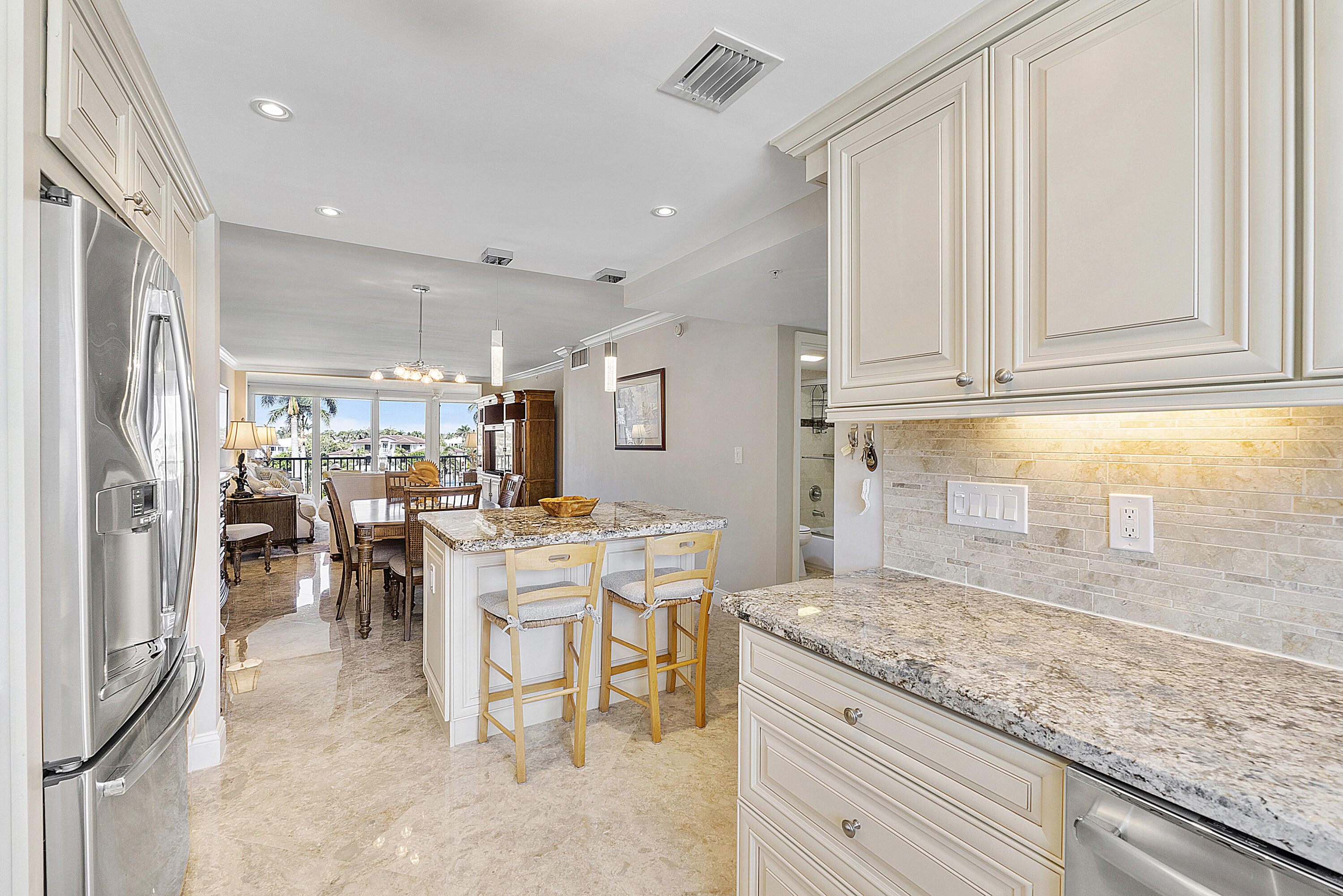 a view of a kitchen and dining area