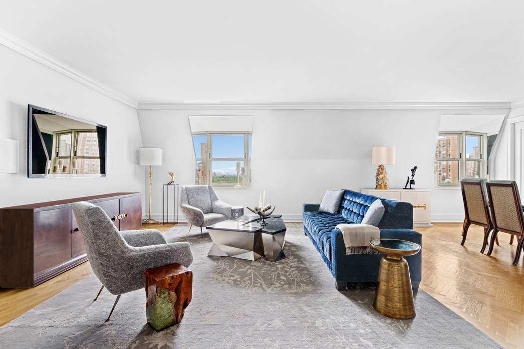 a living room with furniture wooden floor and a table