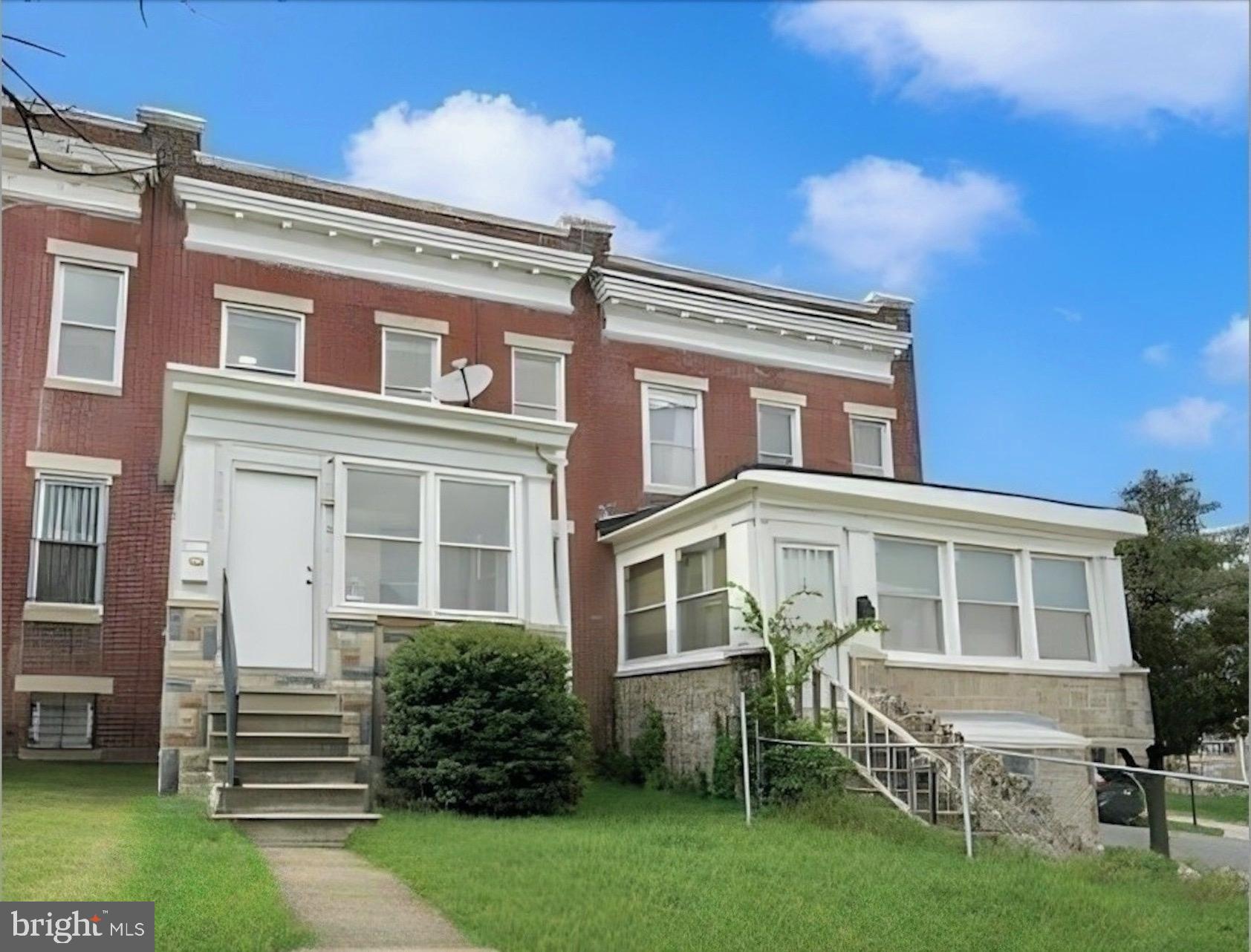 front view of a house with a yard