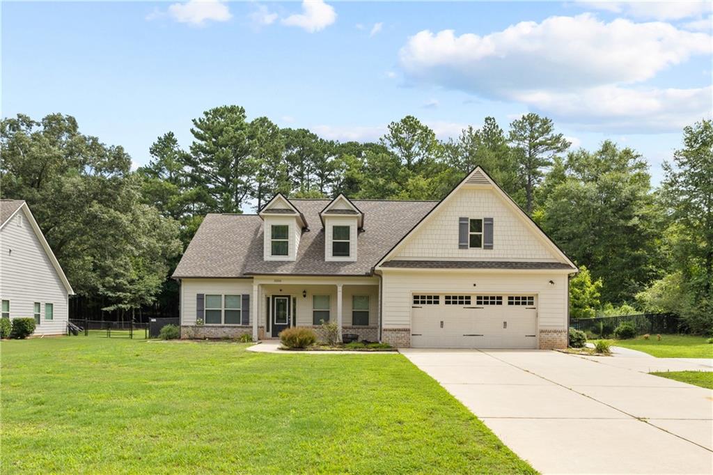 a front view of a house with a yard