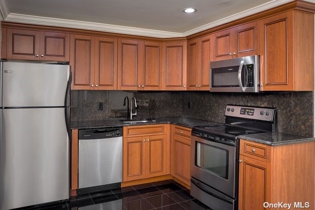 a kitchen with stainless steel appliances granite countertop a refrigerator sink and cabinets