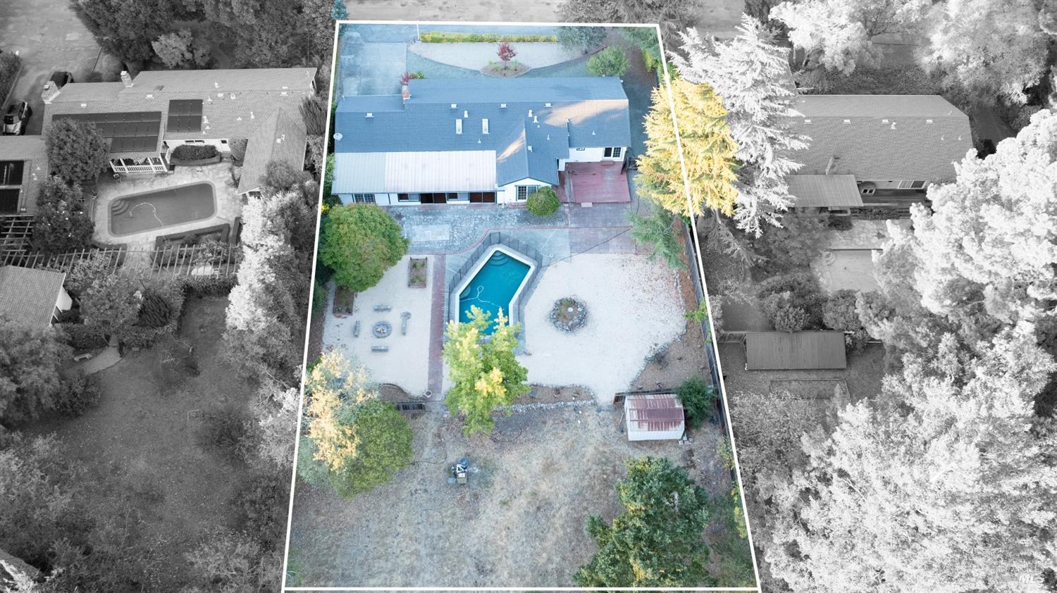 an aerial view of a house with a yard