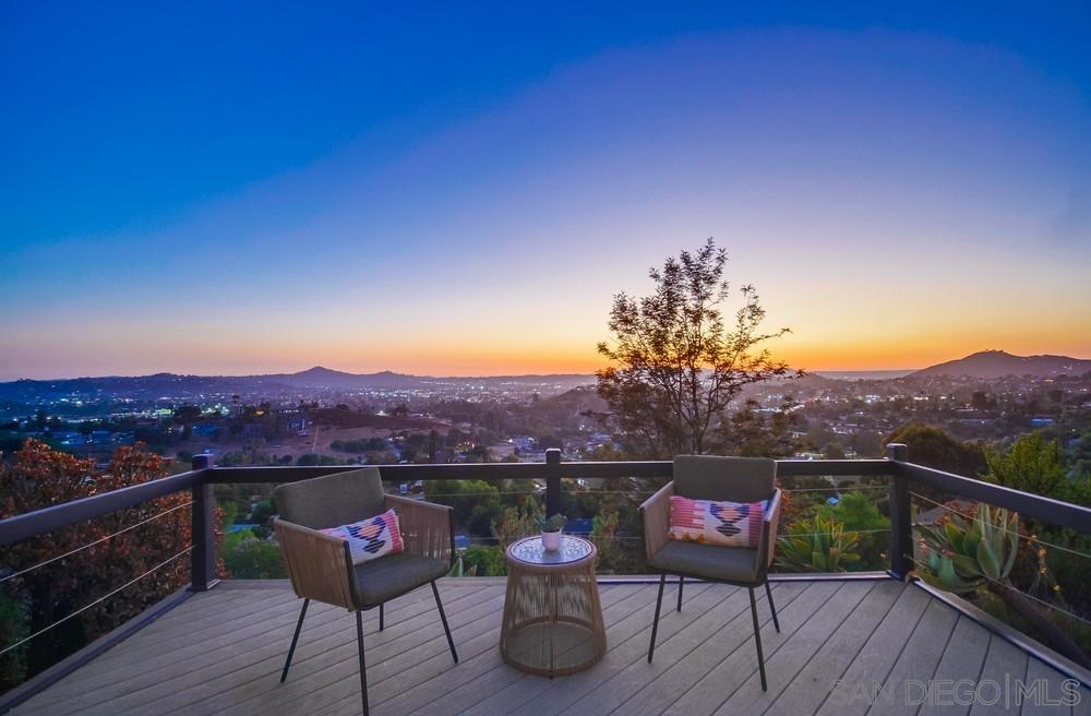 a view of a chairs and table on the deck