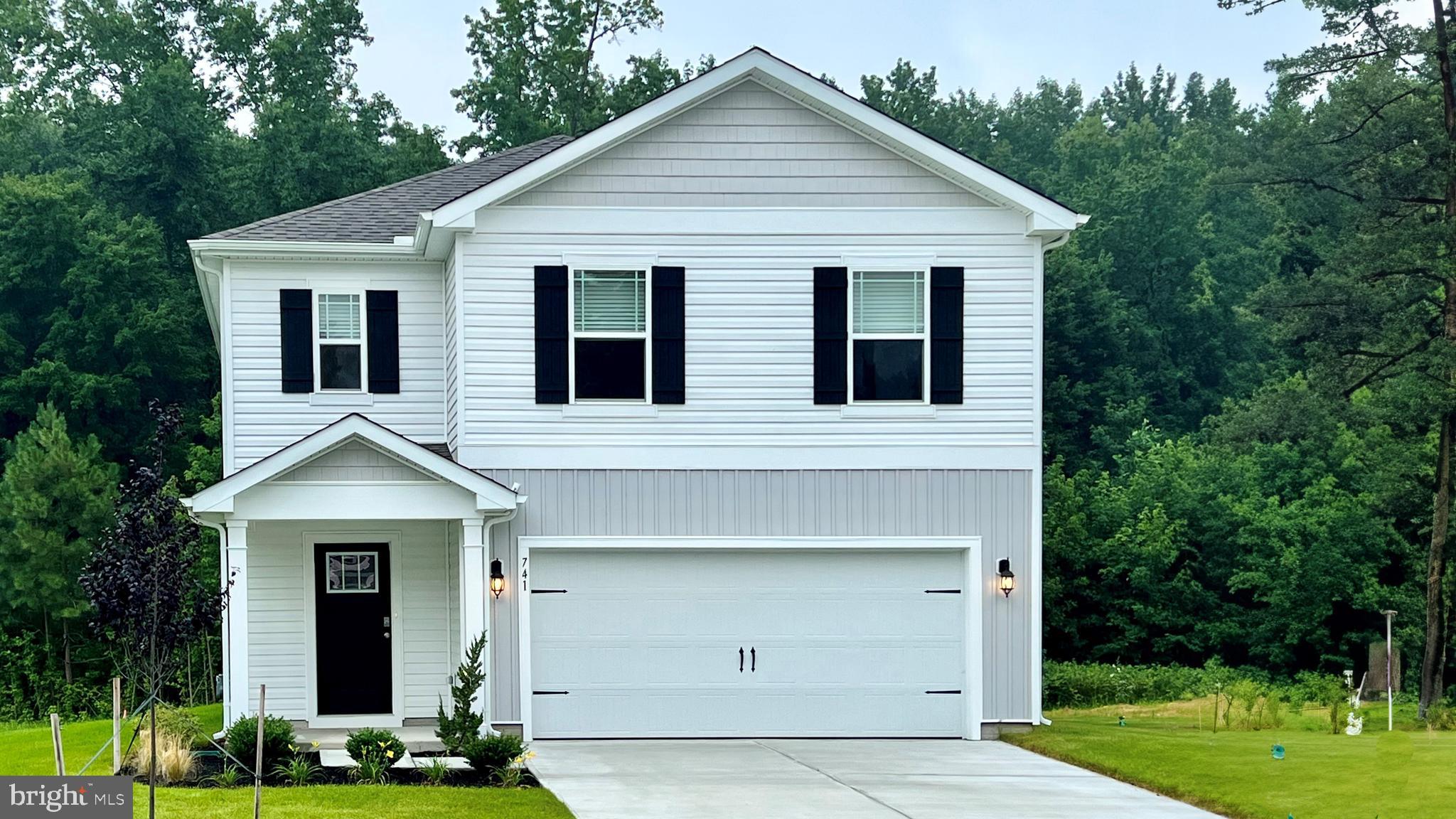 front view of a house with a yard