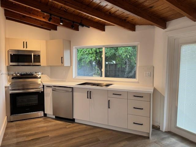 a kitchen with a sink and a microwave