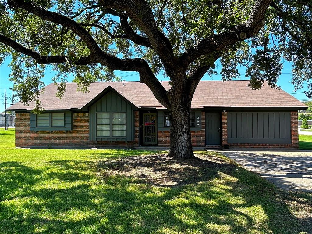 Charming single-story brick home with mature shade tree, featuring a well-maintained lawn, a large air conditioned space in place of garage. Located minutes form downtown Old La Porte.