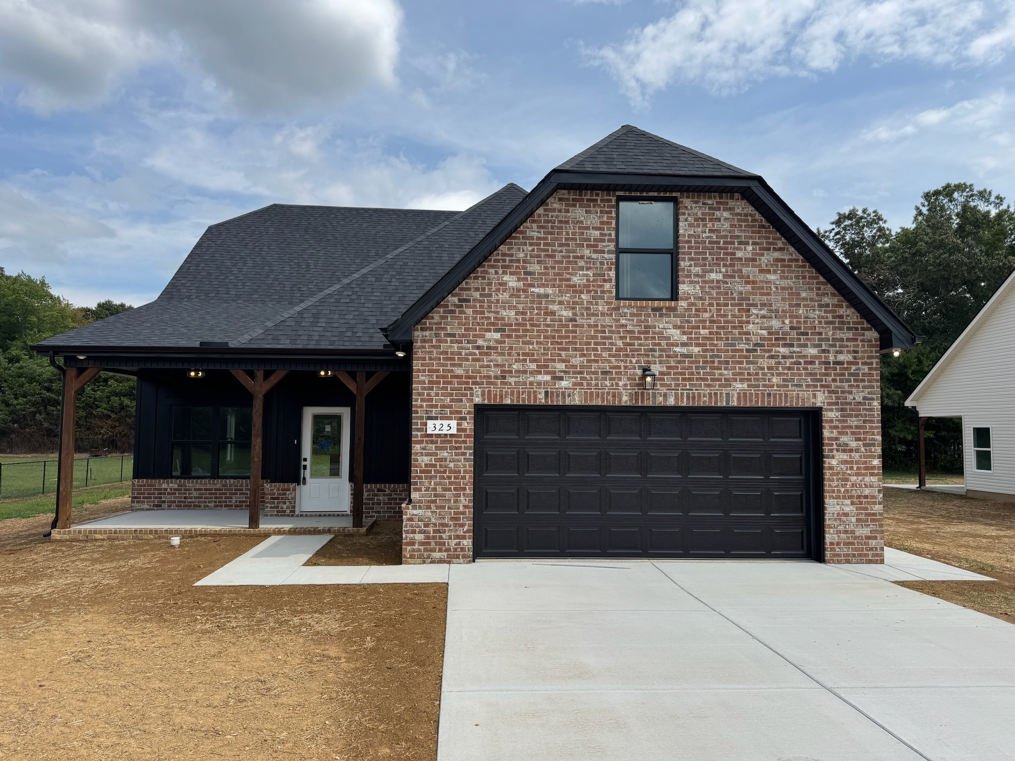 a front view of a house with yard