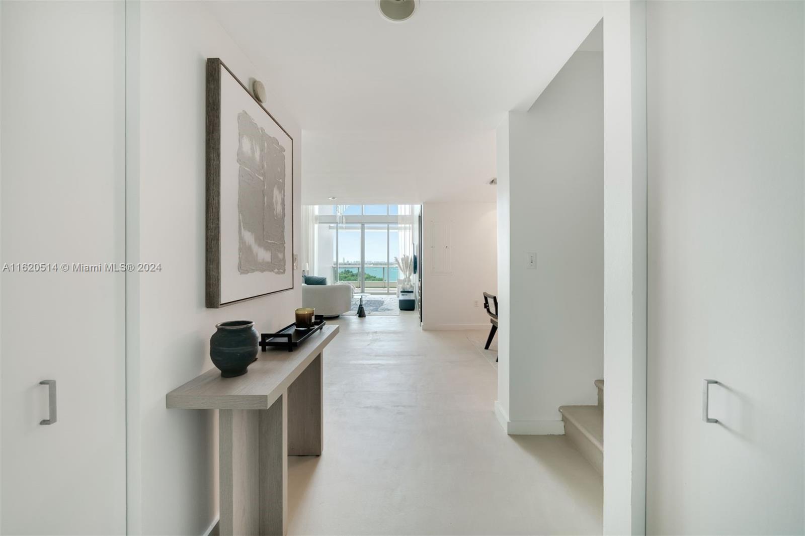 a view of a livingroom with furniture and windows