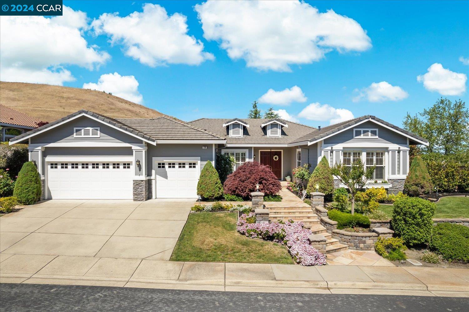 a front view of a house with a yard