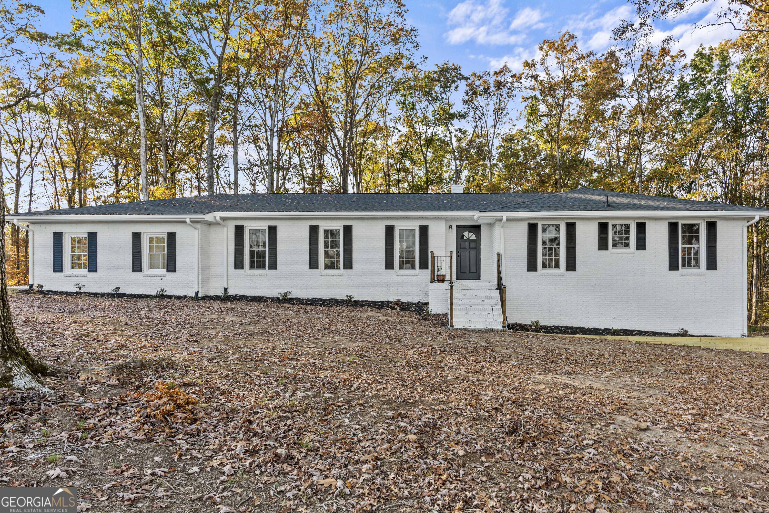 front view of a house with a yard