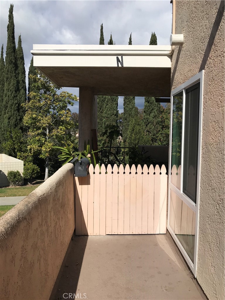 a view of balcony with furniture