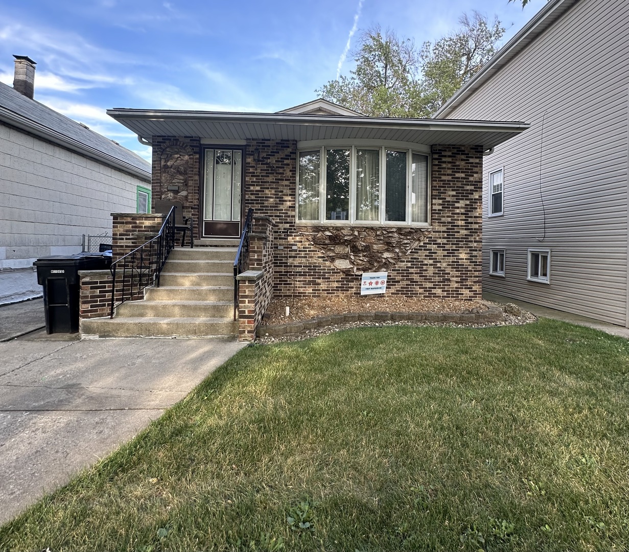 a view of house with backyard