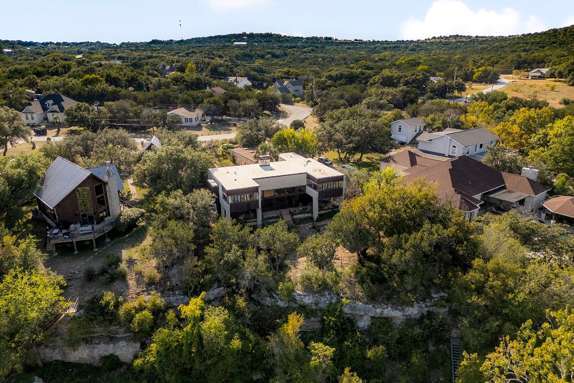 This unique home is designed to take full advantage of its breathtaking surroundings, with amazing views of the Colorado River and Lake Travis, plus an inlet directly behind the home.