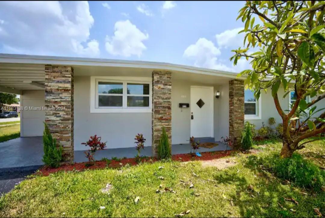 front view of a house with a yard