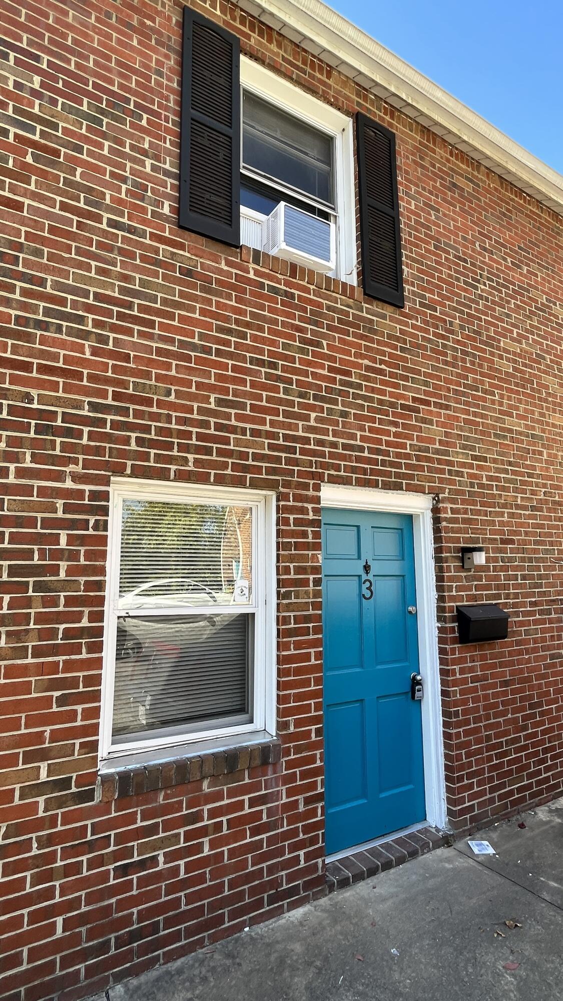 a brick house with a door and a door