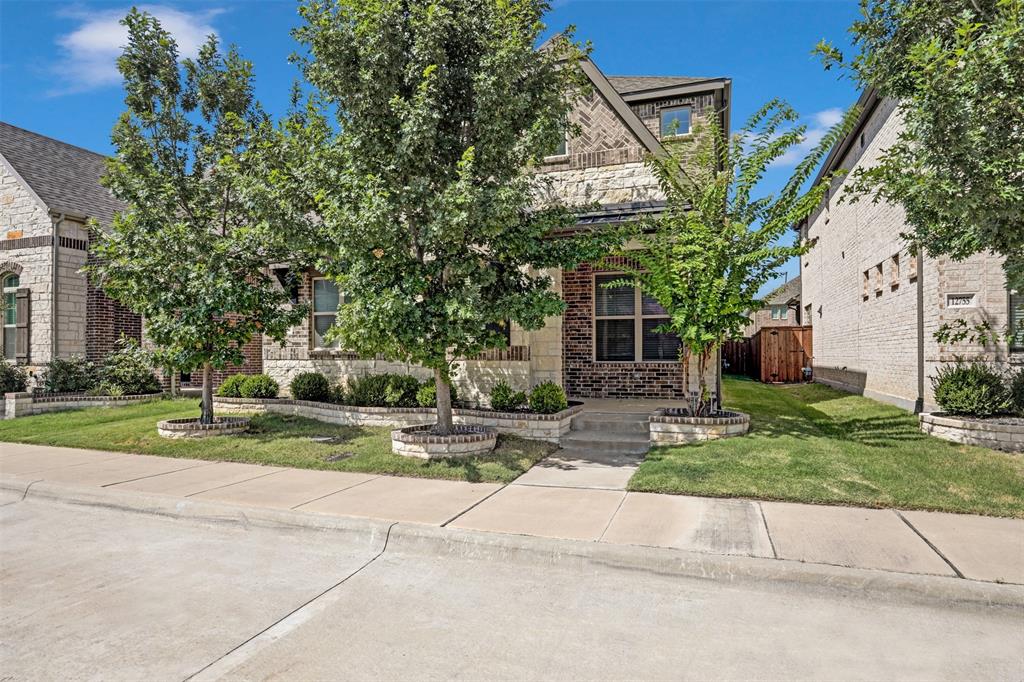 a house that has a tree in front of it