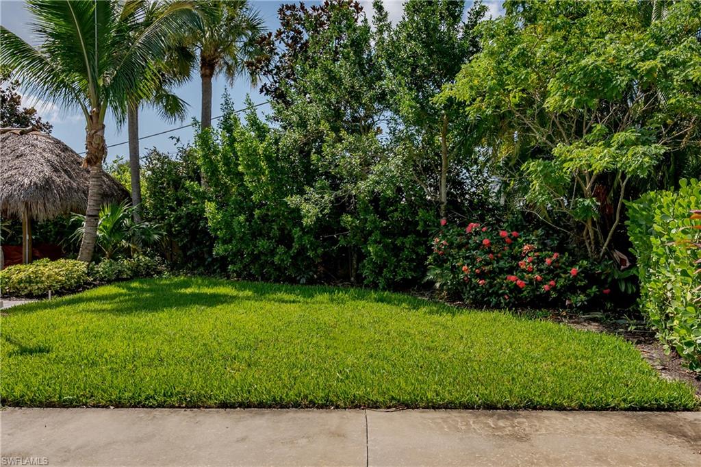 a view of a garden with a house