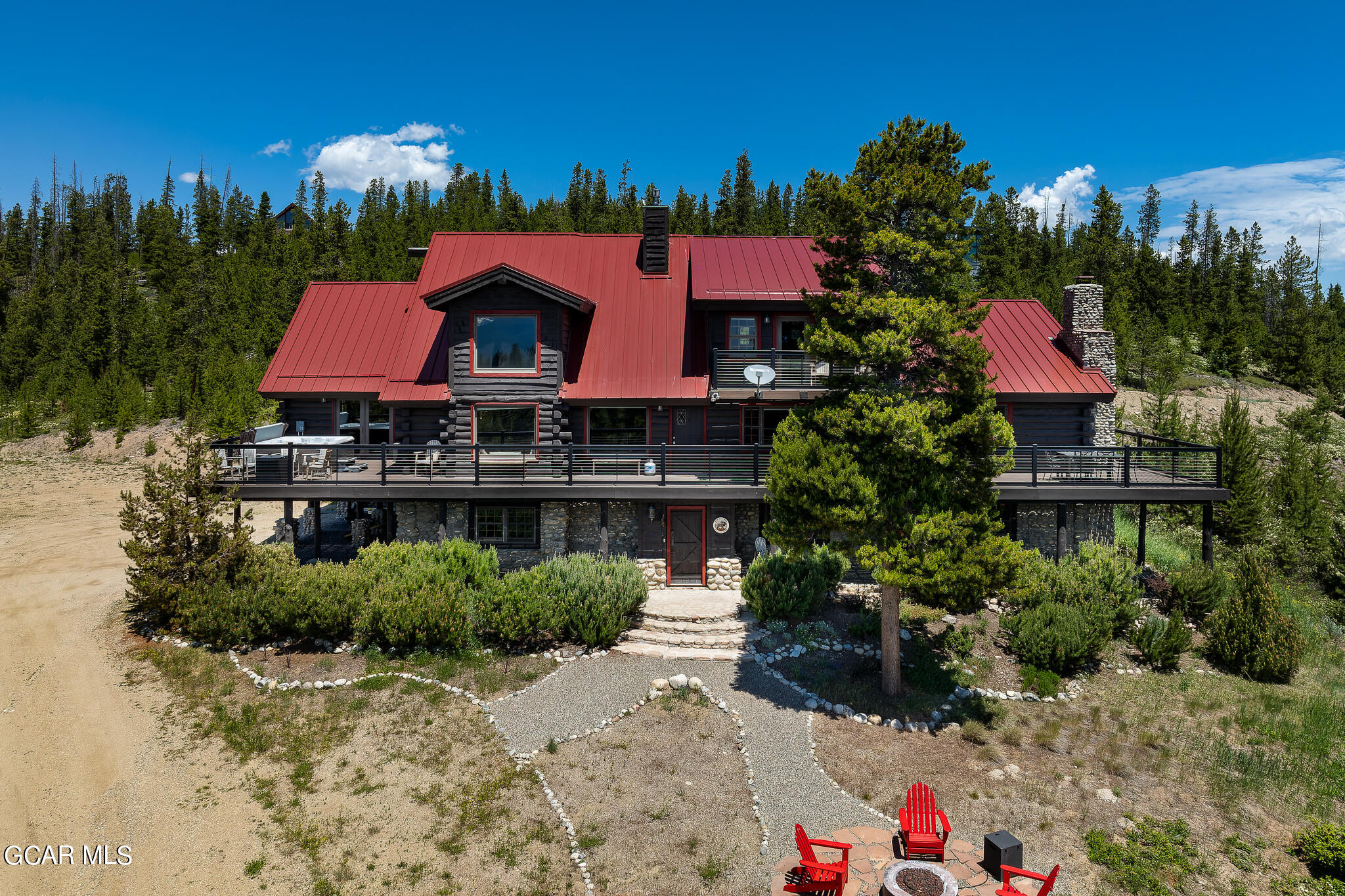 a view of house with outdoor space and sitting area