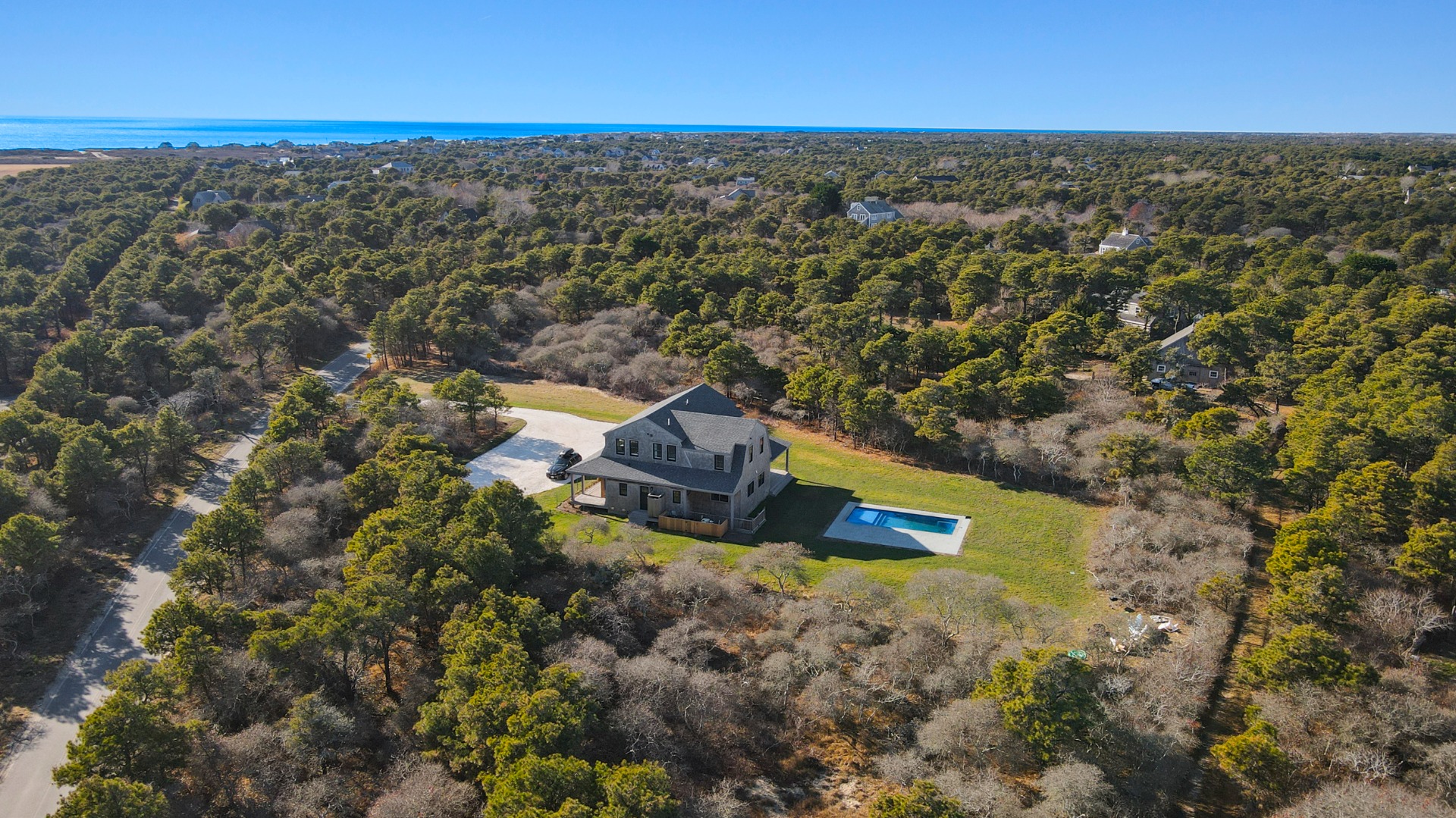 an aerial view of residential houses with outdoor space