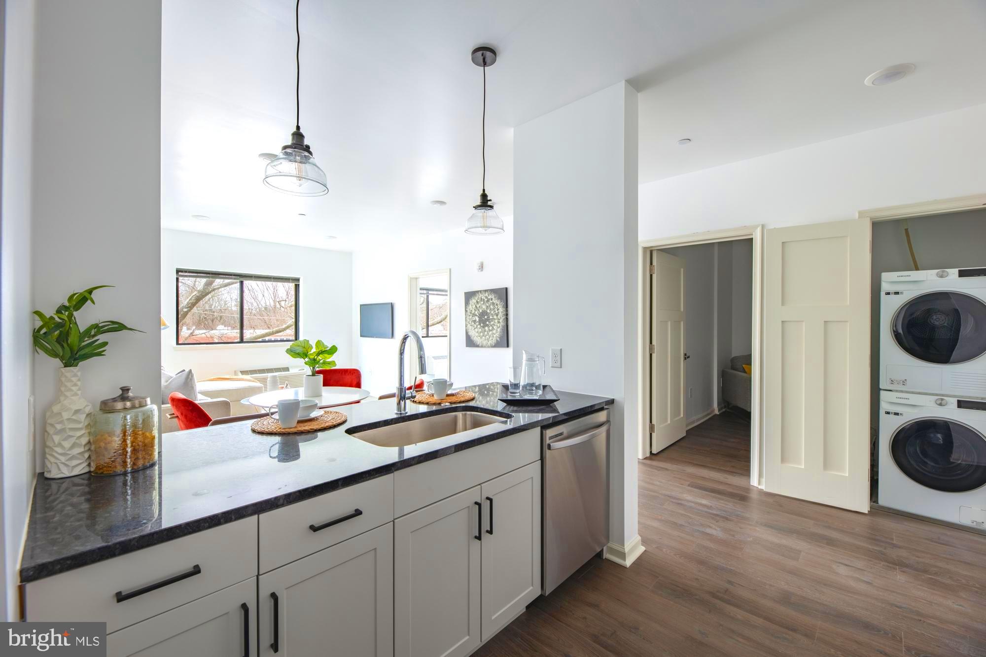 a kitchen with sink cabinets and stove