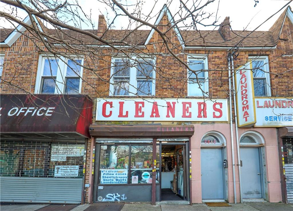 a front view of a building with retail shops