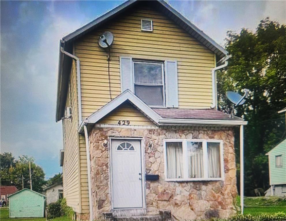 a front view of a house with a porch