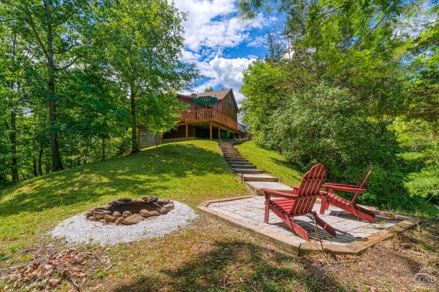 a view of a backyard with sitting area