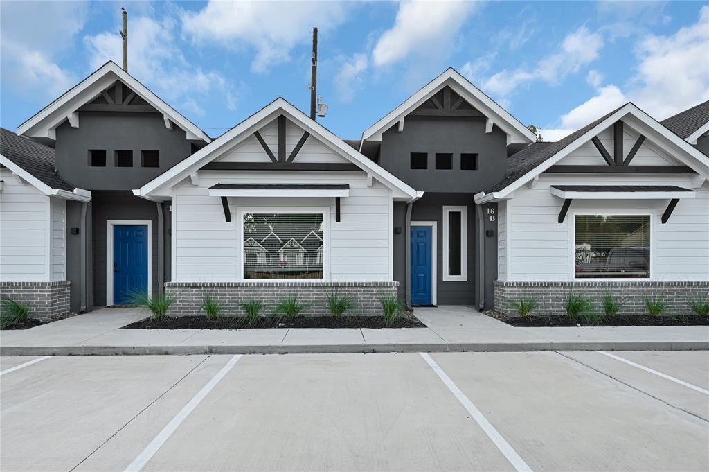 a front view of a house with garage and garage