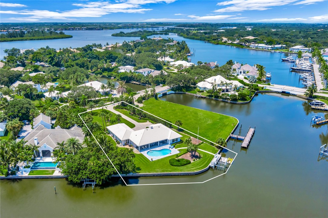 an aerial view of a house with a lake view