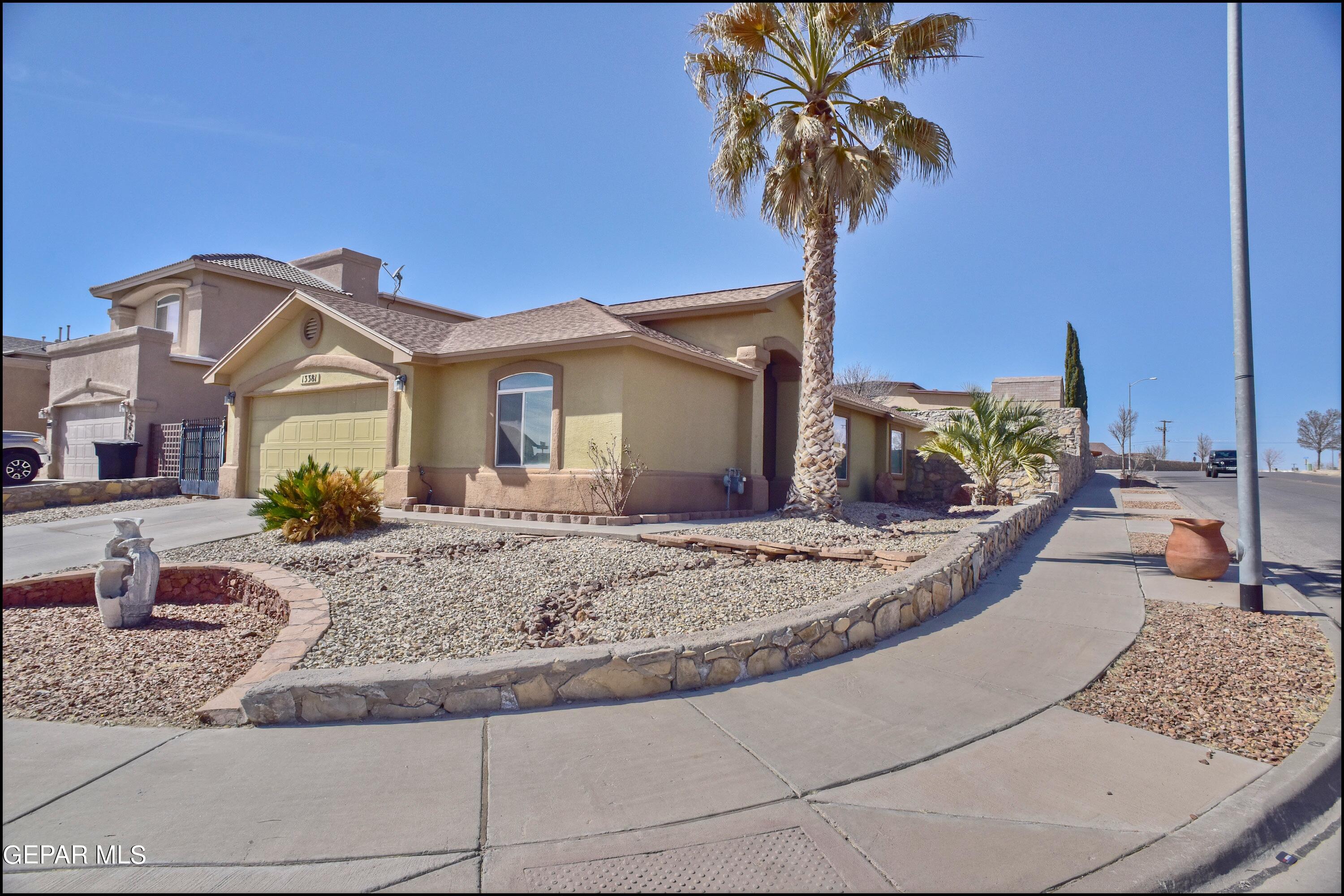 a view of a house with a swimming pool and a yard