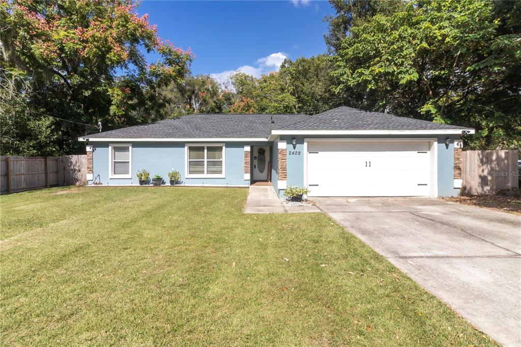 front view of a house with a yard