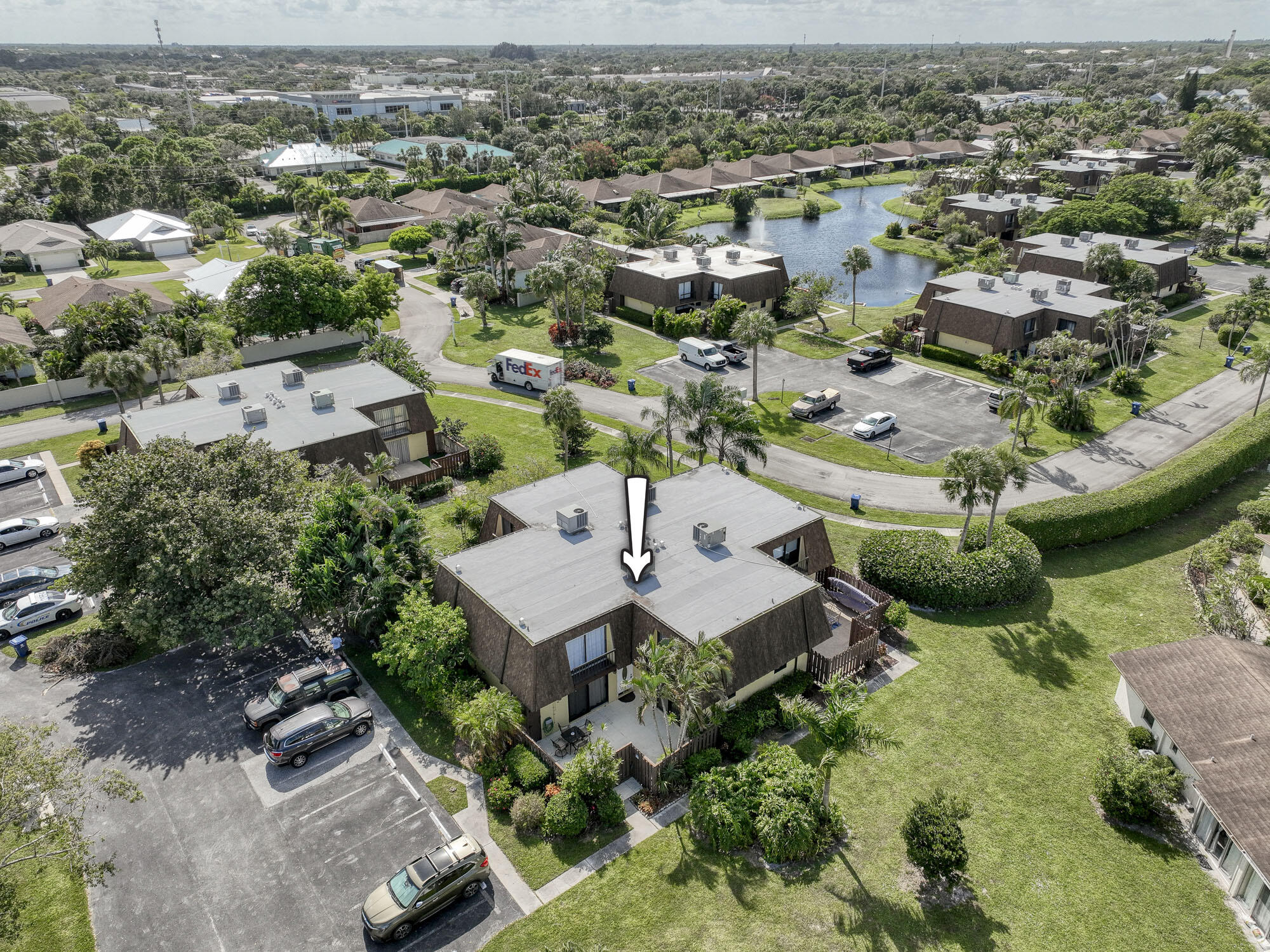 an aerial view of multiple houses with yard