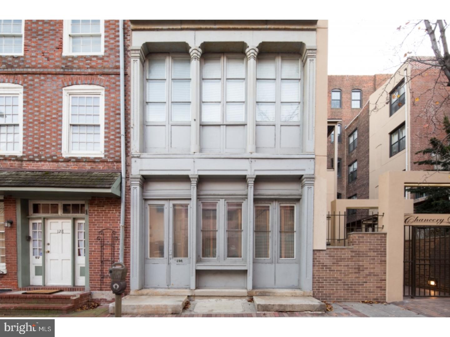 a front view of a house with a glass windows