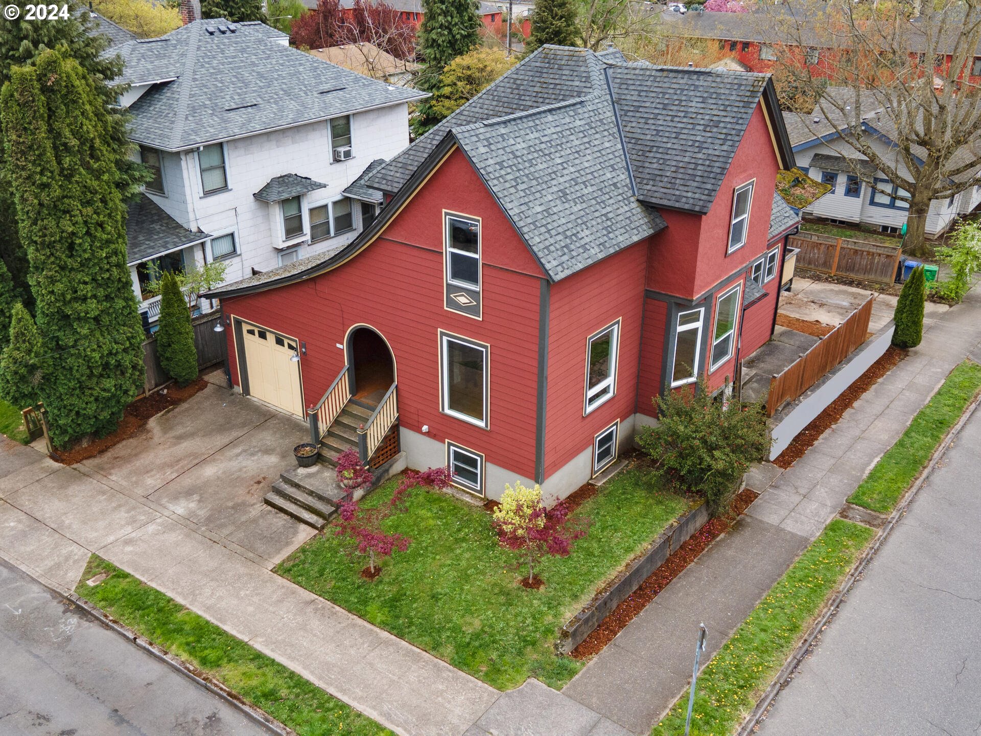 a front view of a house with garden