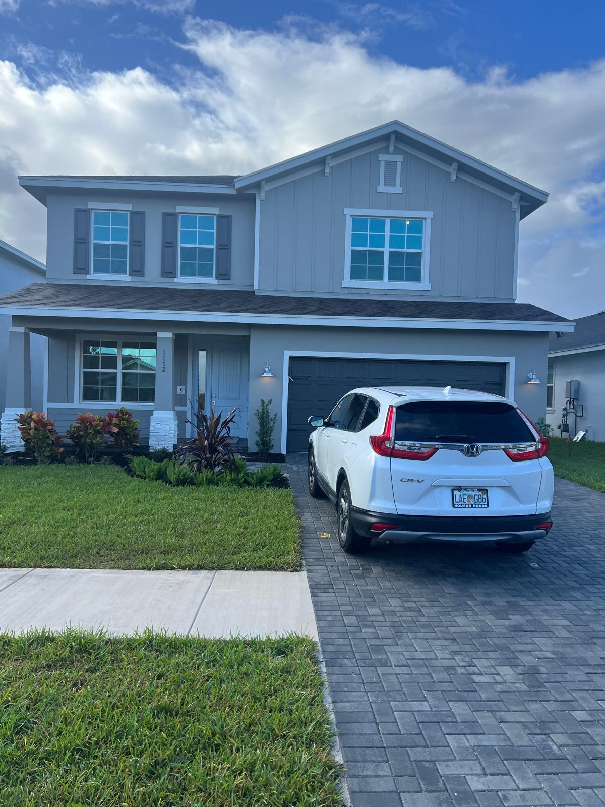 a view of a car in front of a house