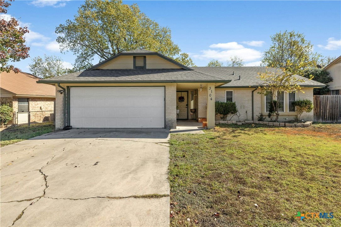 a front view of a house with yard