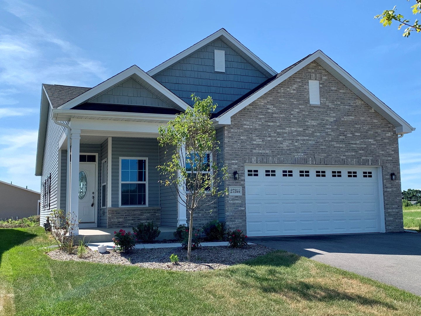 front view of a house with a yard