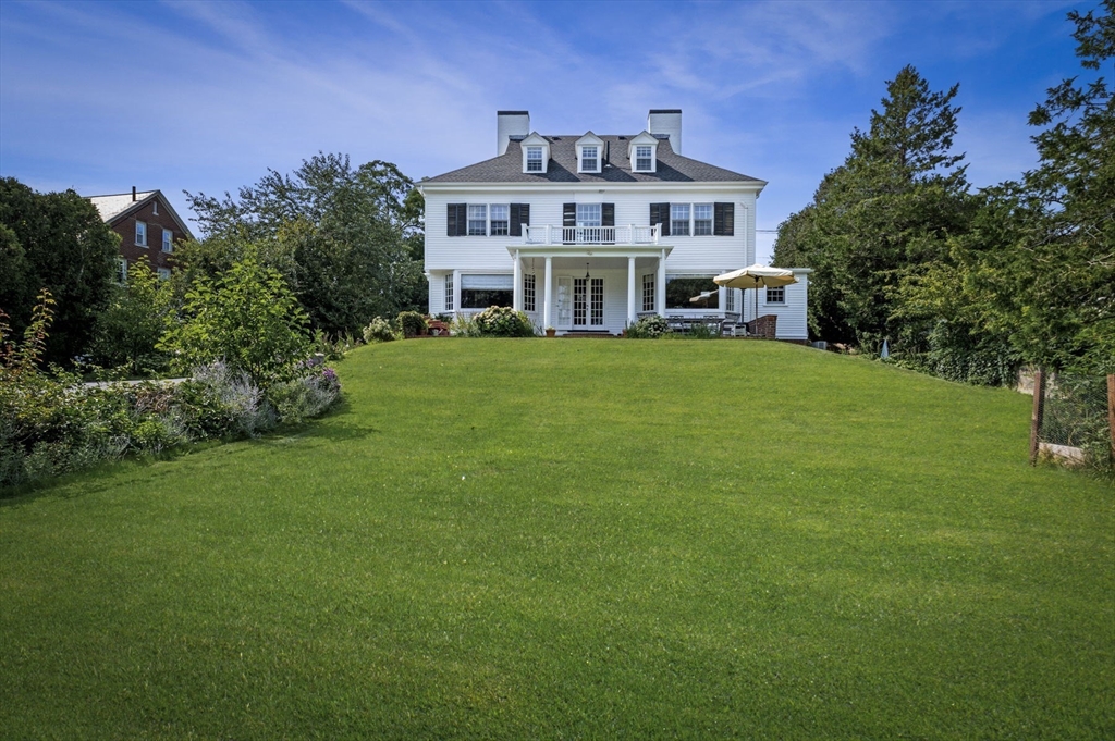 a view of a house with a big yard