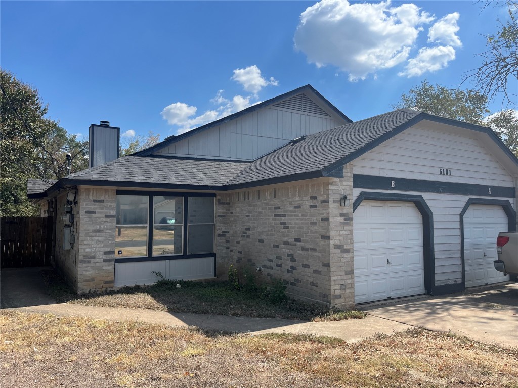 a front view of a house with a garage